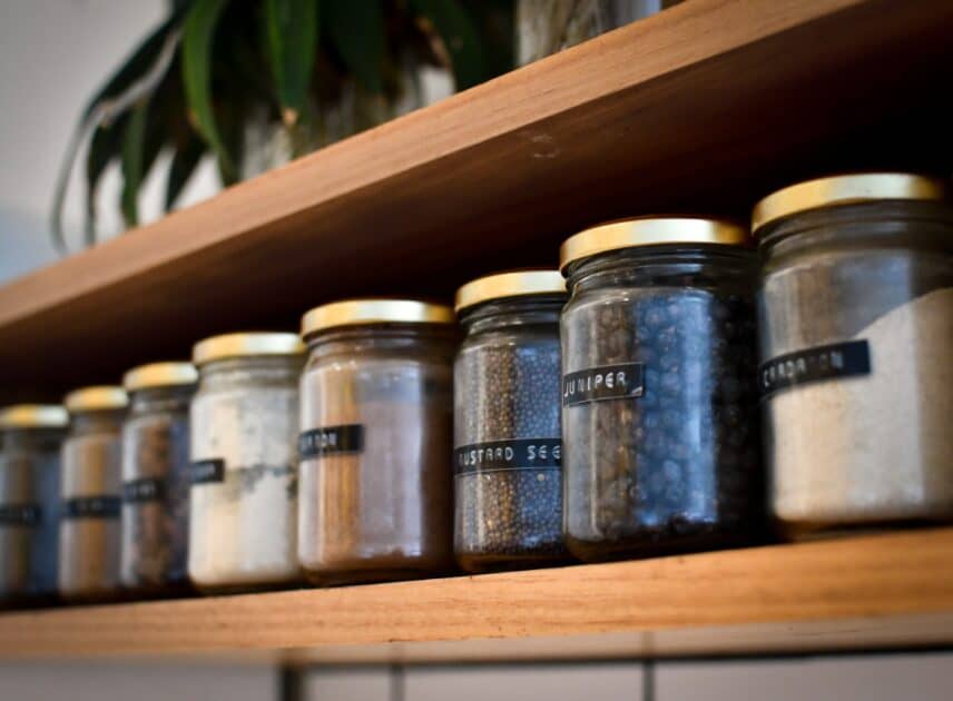 Shelf with glass spice jars.