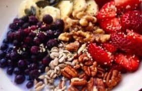 Muesli in a bowl with fruit.