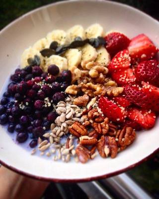 Muesli in a bowl with fruit.