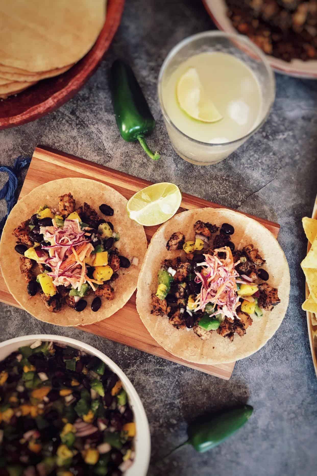 Two open vegan fish tacos.