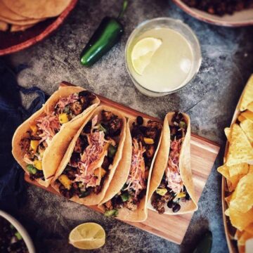 Vegan fish tacos on a cutting board.