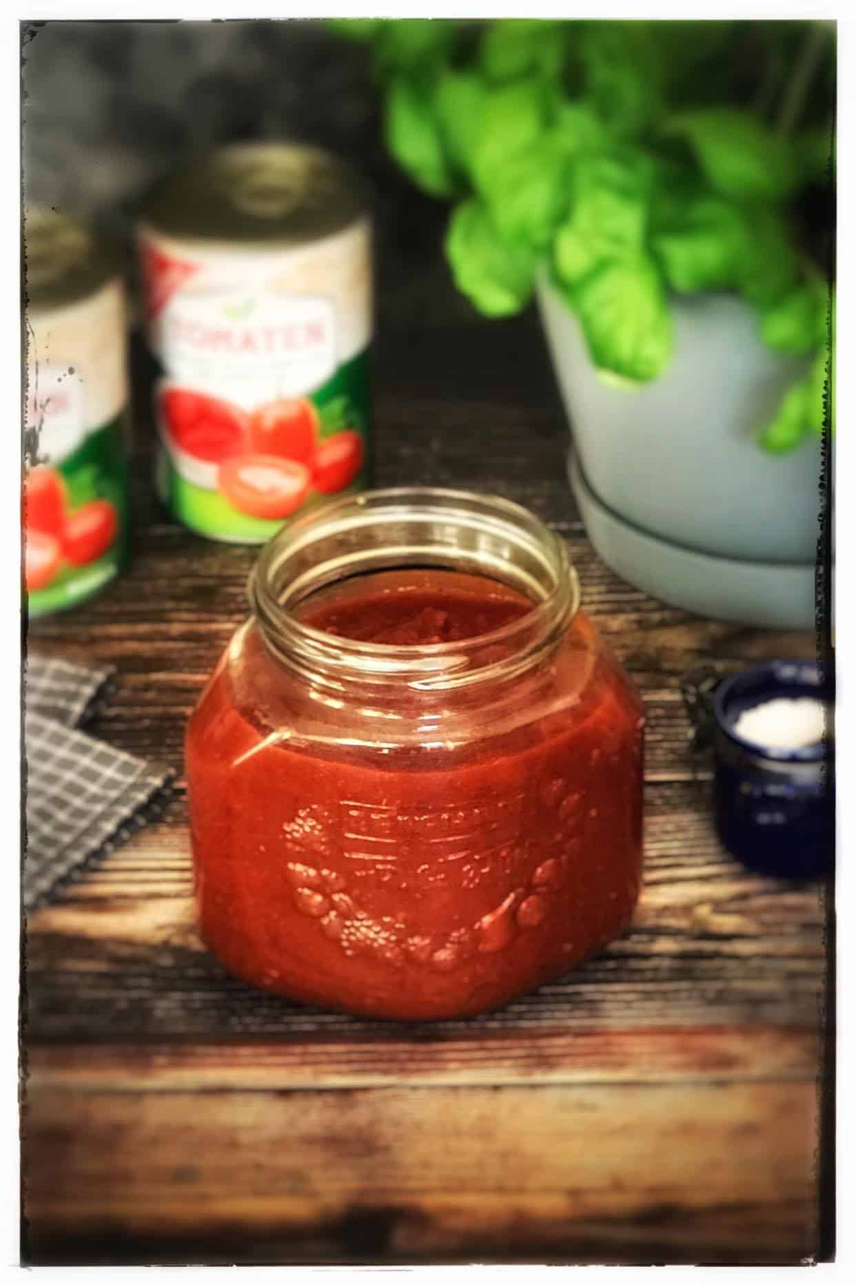 Jar of homemade marinara sauce.