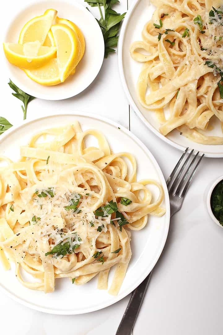 Vegan lemon pasta on two plates.