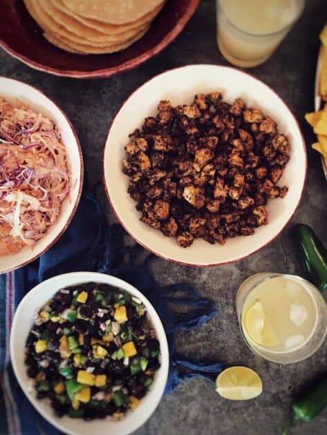 Components of vegan fish tacos in separate bowls.