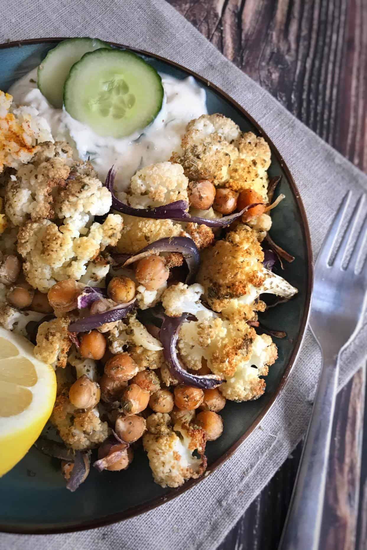 Cauliflower and chickpea bake with vegan tzatziki and couscous.