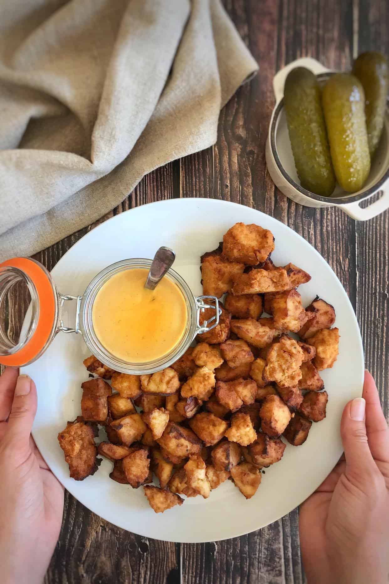 Chick-fil-A tofu on a plate with vegan honey mustard.