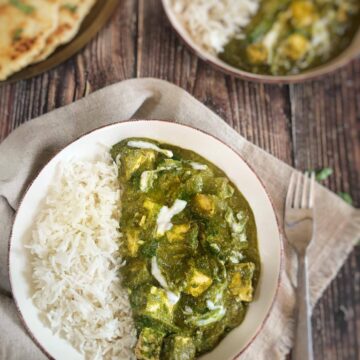 Vegan palak paneer in a bowl with rice.