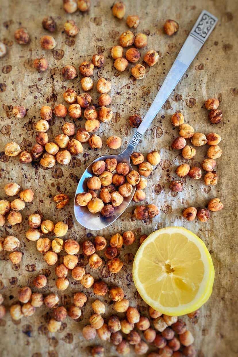 Roasted chickpeas on a baking sheet.