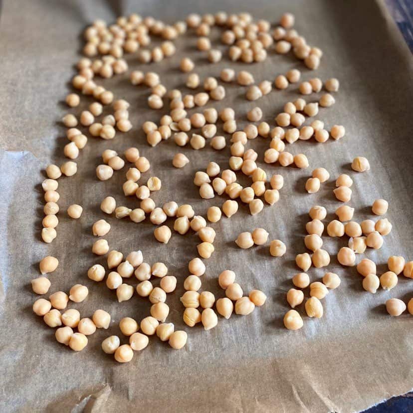 Chickpeas on a baking sheet.