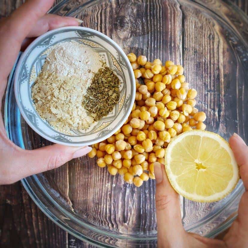 Adding seasoning to the chickpeas.