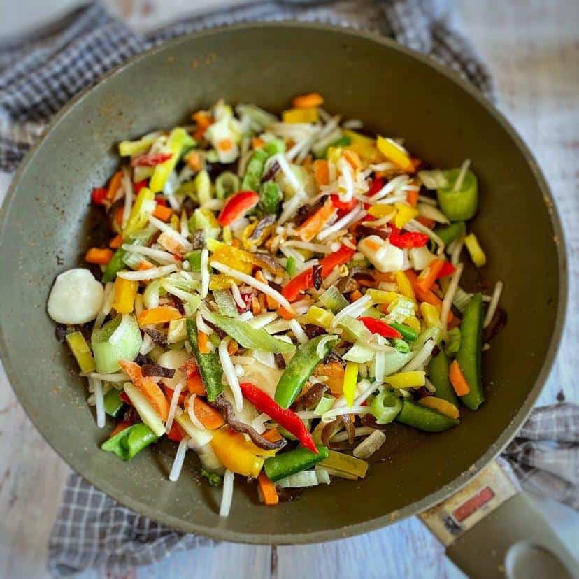 Frozen vegetables in a skillet.