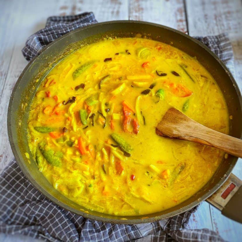 Yellow Thai curry in a skillet.