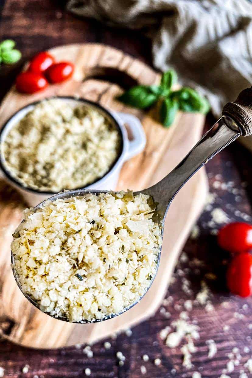 Closeup of vegan parmesan in a spoon.