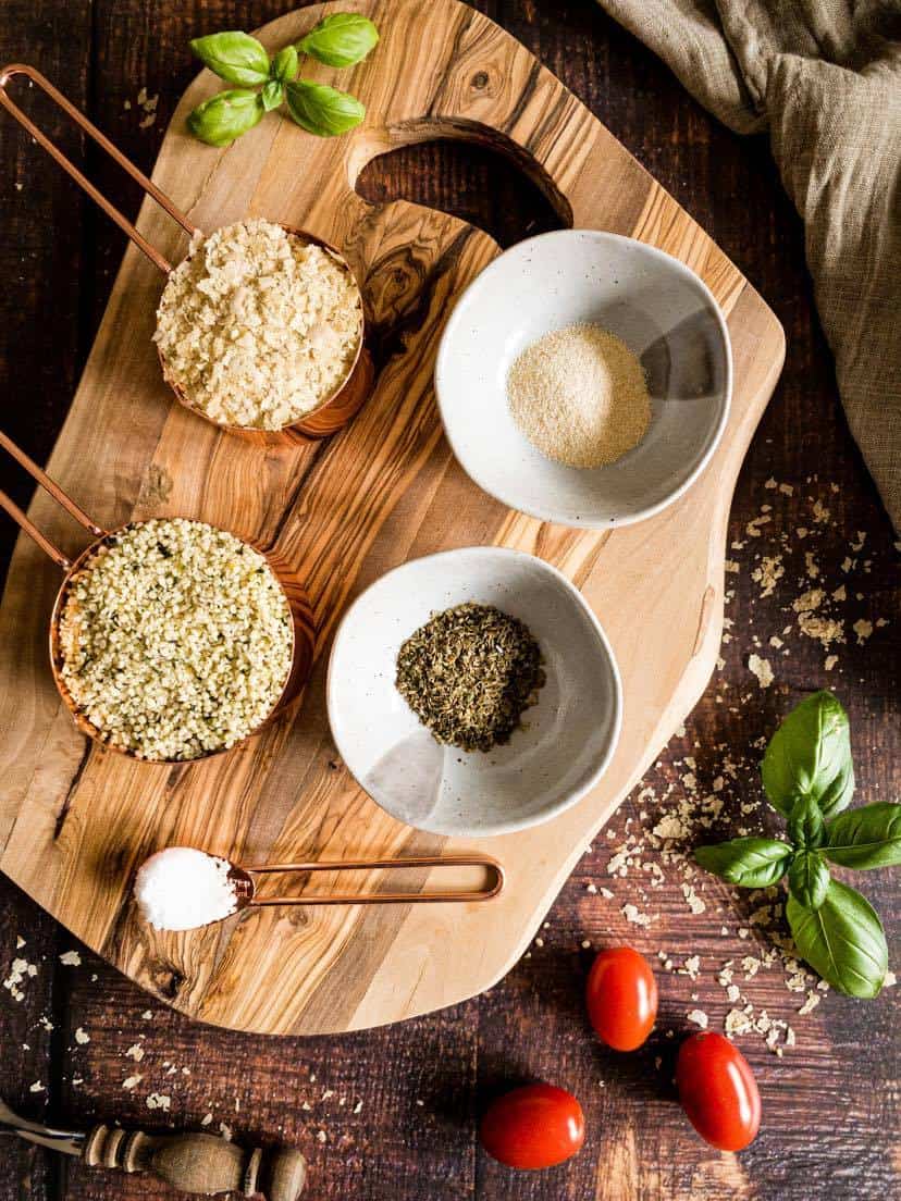 Ingredients for vegan parmesan on a cutting board.