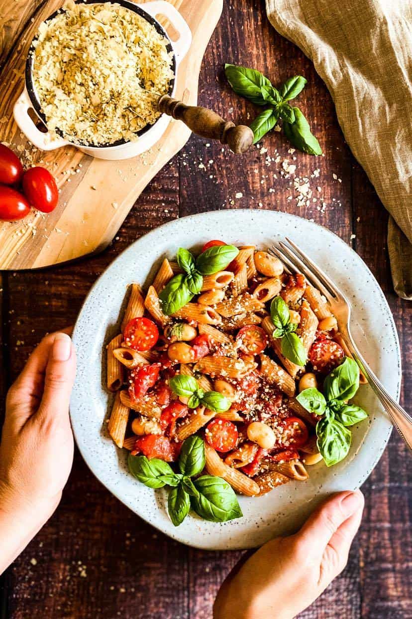 Vegan parmesan on pasta.