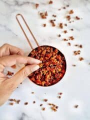 vegan bacon bits in measuring cup