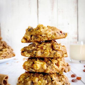 Vegan oatmeal raisin cookies stacked.