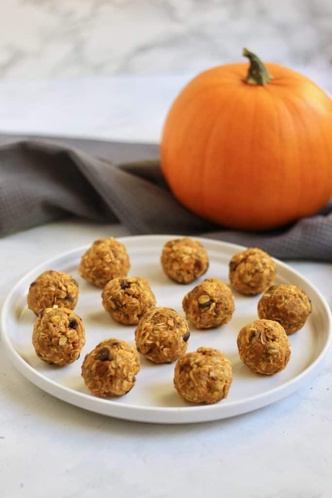 Pumpkin energy bites on a plate.