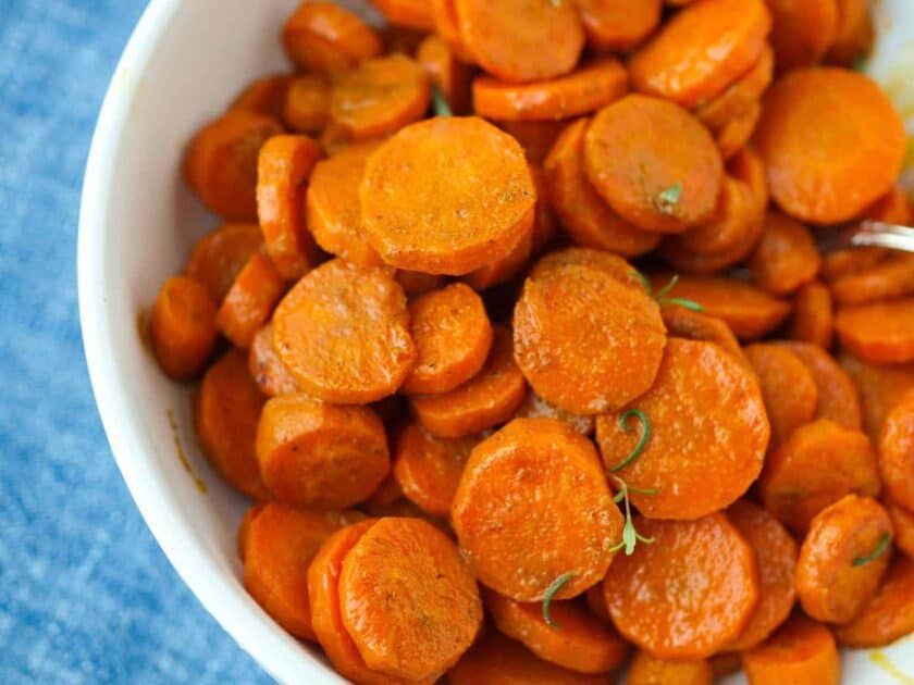 Bowl of roasted turmeric and cumin carrots.