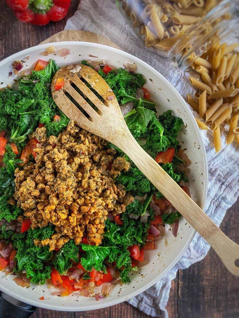 Vegan Italian sausage crumbles added to the skillet.