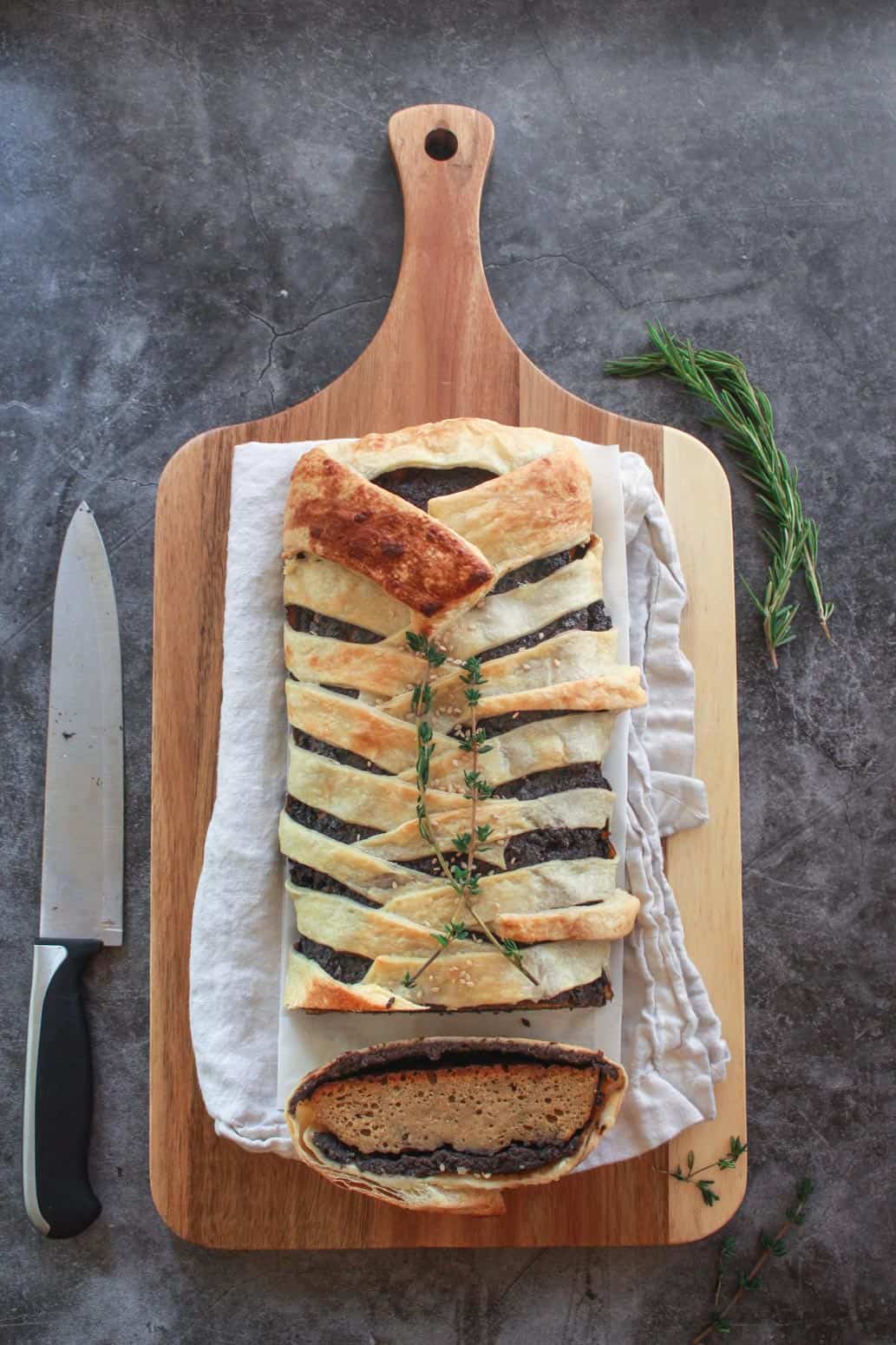 Vegan seitan wellington on a cutting board.