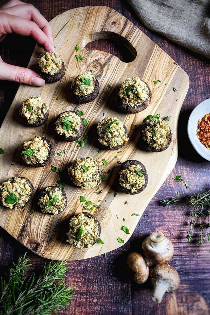 Vegan stuffed mushrooms on a cutting board.