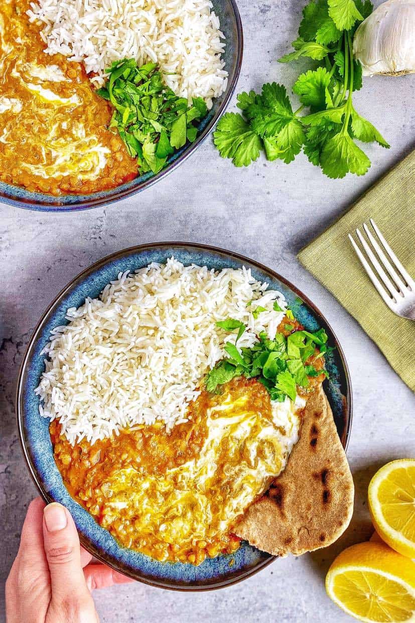 Red lentil dal in a bowl with rice.