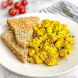 Tofu scramble on a plate with toast.