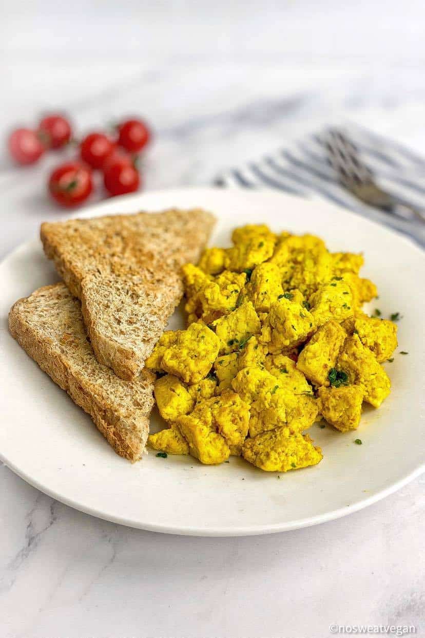 Tofu scramble on a plate with toast.