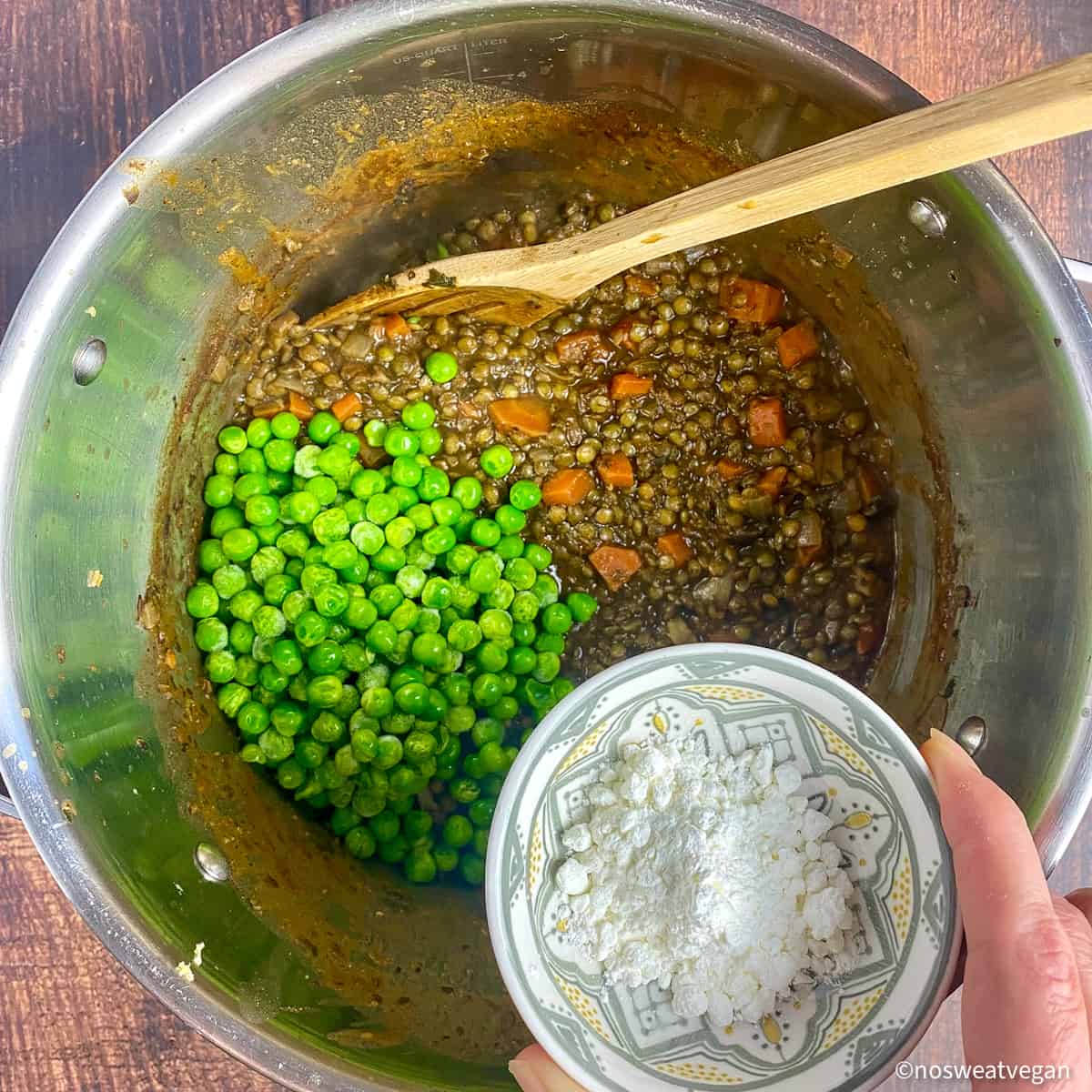 Frozen peas and cornstarch added to the lentil mixture.