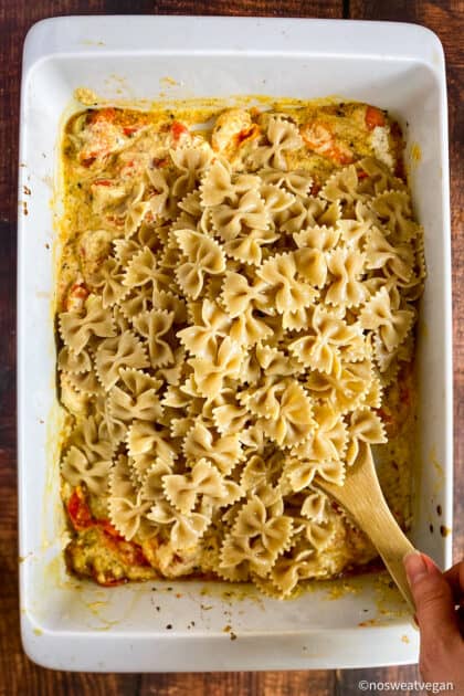 Bow tie pasta in a baking dish.