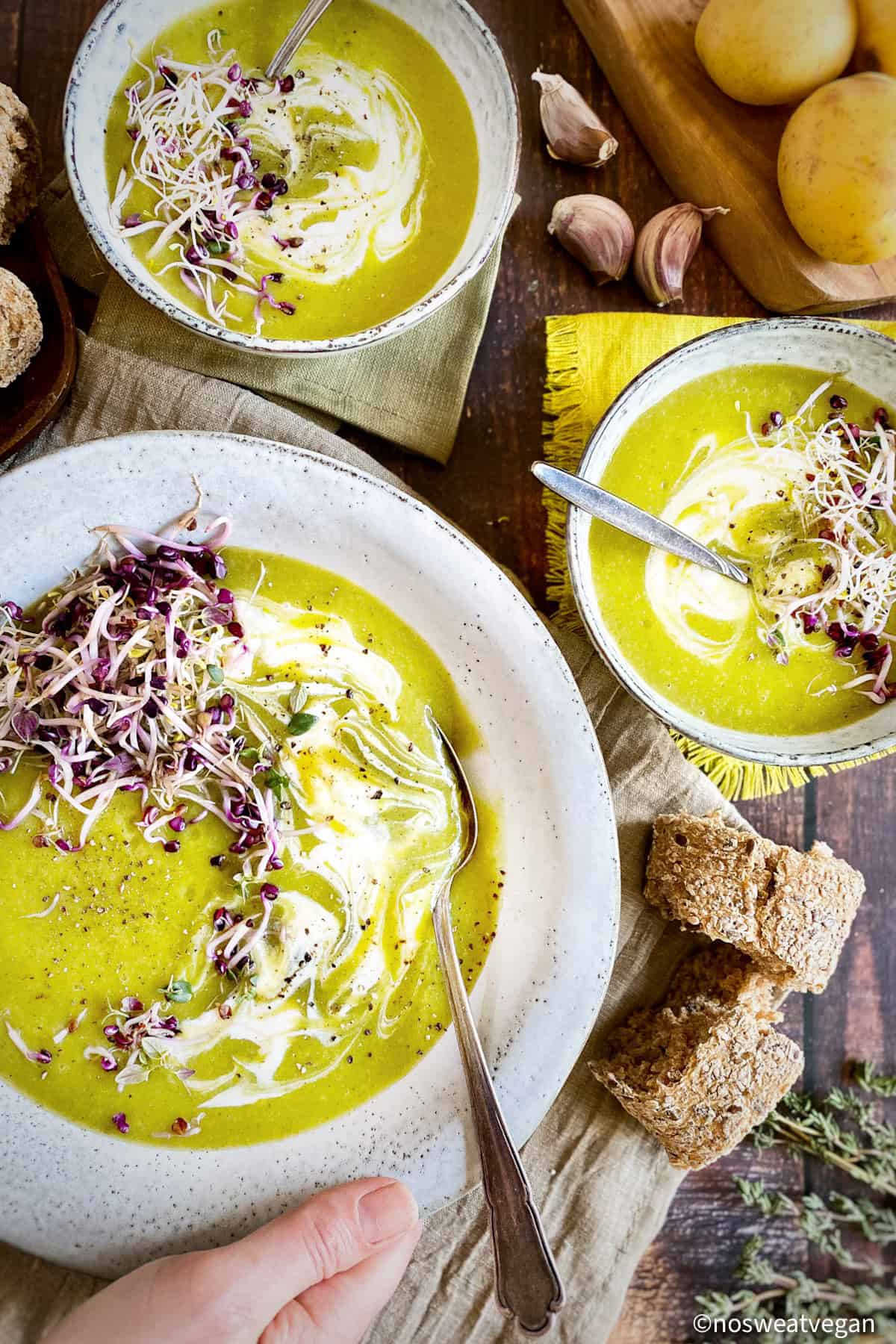 Potato leek soup in 3 bowls.