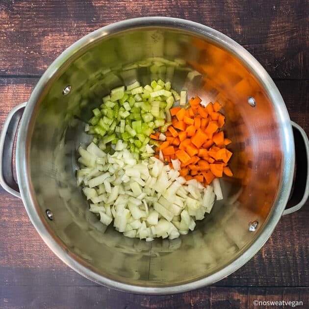 Add the onions, celery, and carrots to the pot.