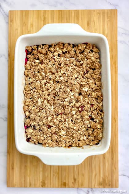Vegan berry crumble in baking dish just out of the oven.