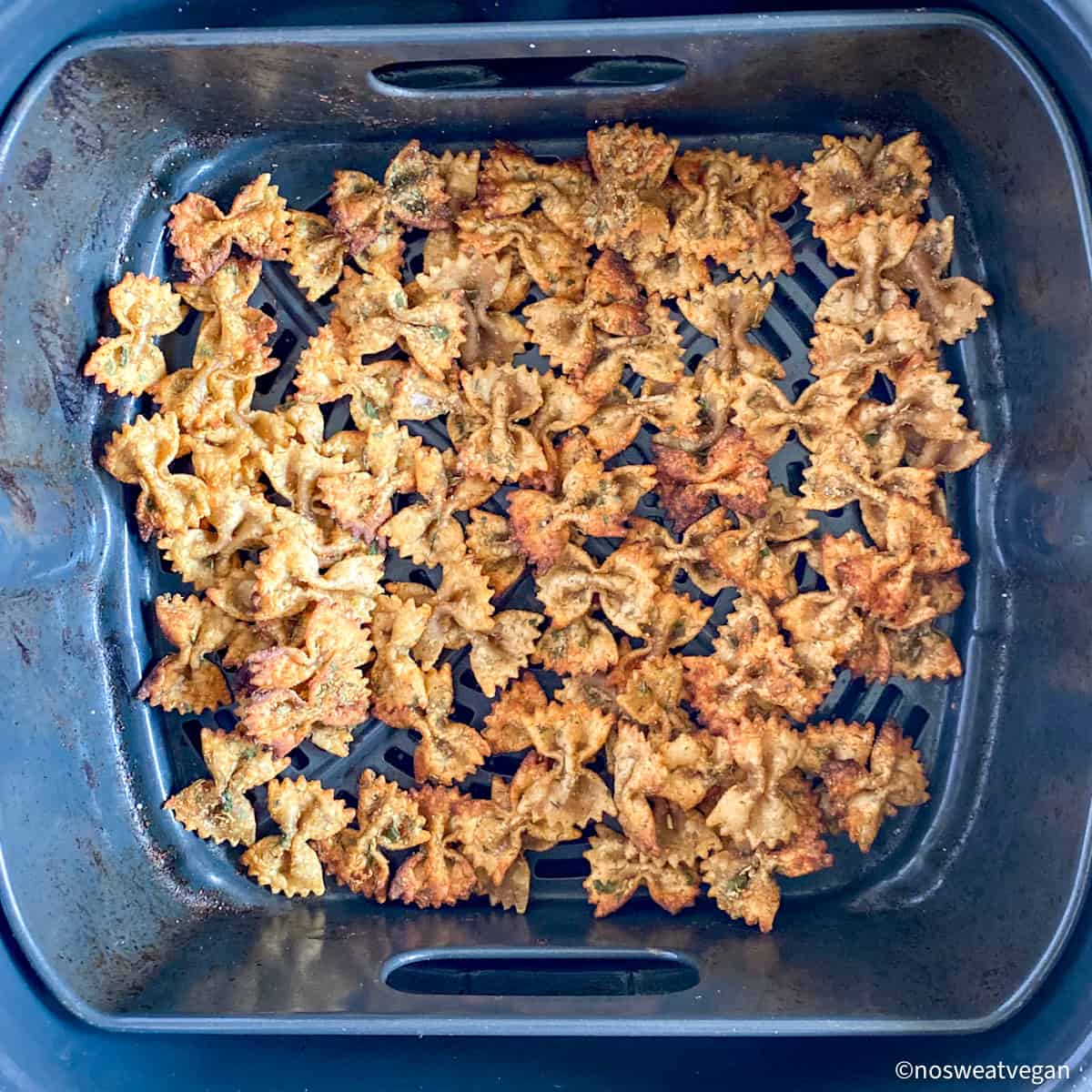 Air fried pasta chips in basket.