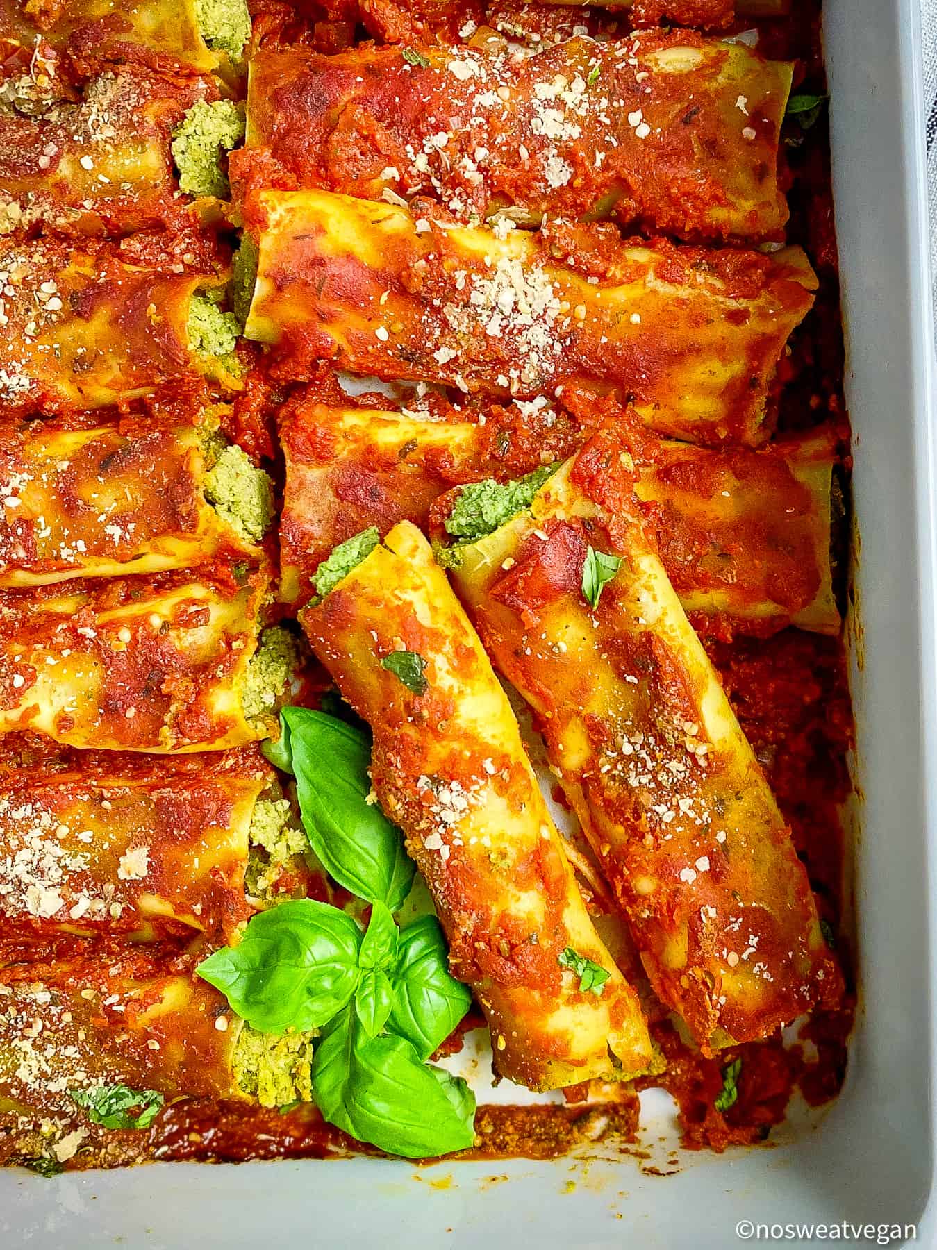 Vegan canelloni in pan with basil.