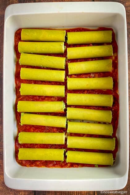 Filled vegan cannelloni in pan, uncooked.
