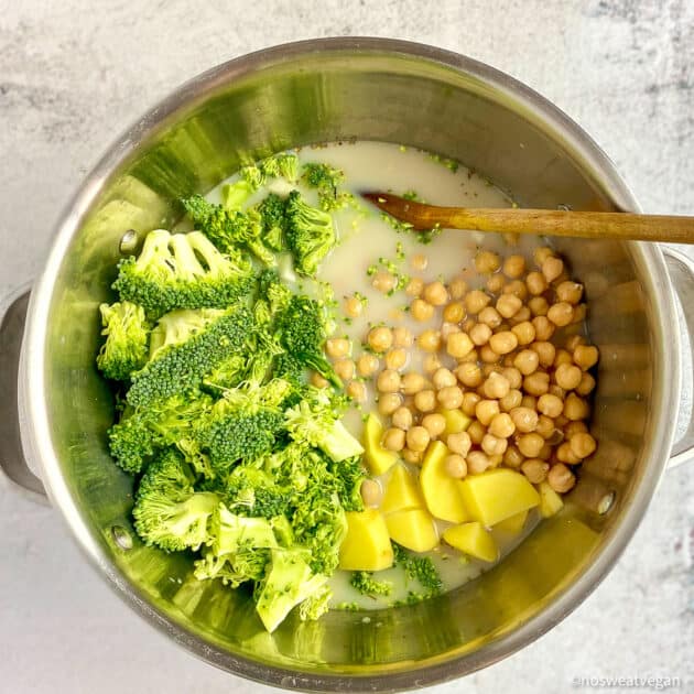 Add broccoli, potatoes, and chickpeas to the soup.