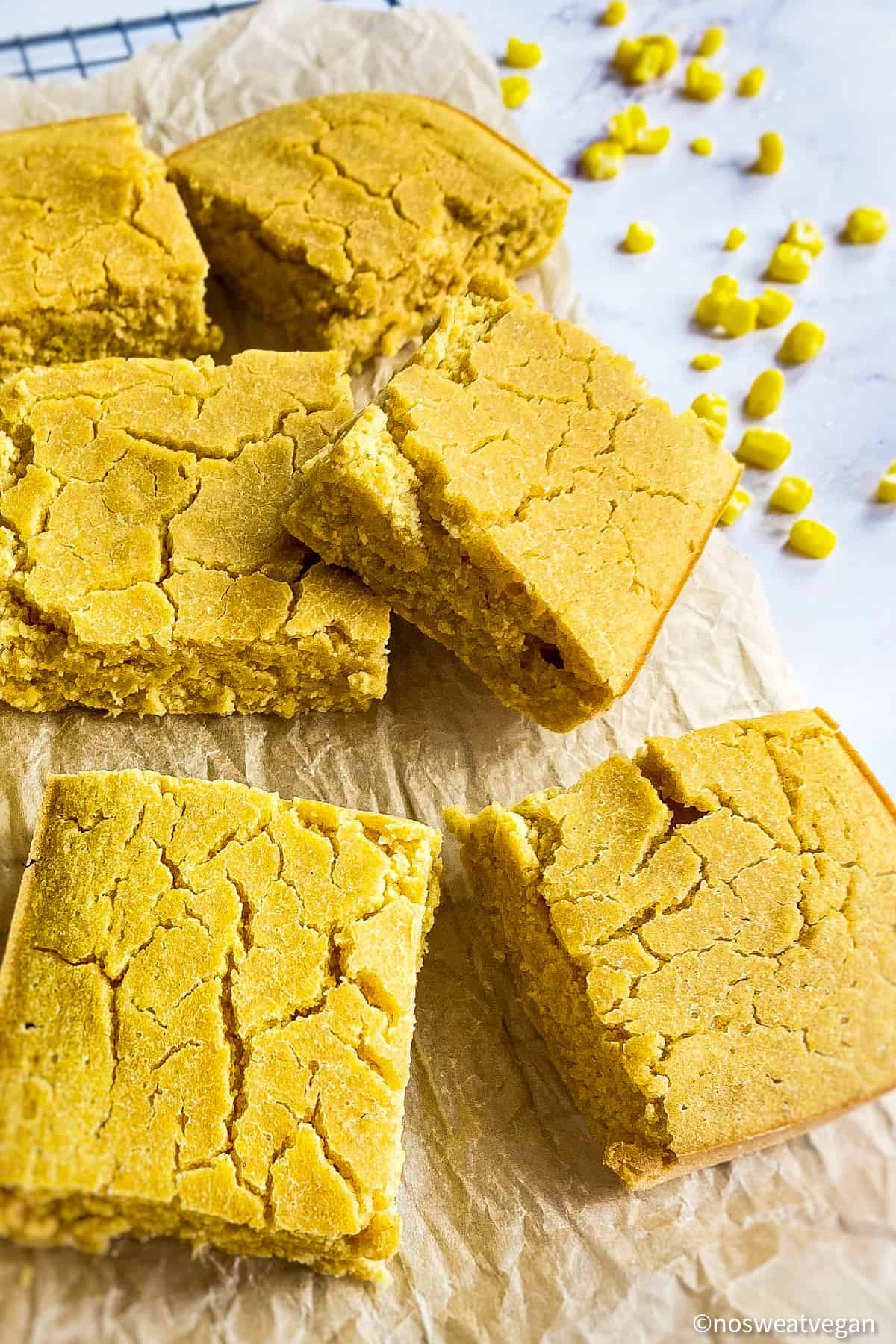 Oil-free cornbread cut in squares on a cooling rack.