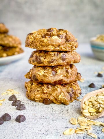 Vegan oatmeal chocolate chip cookies stacked.