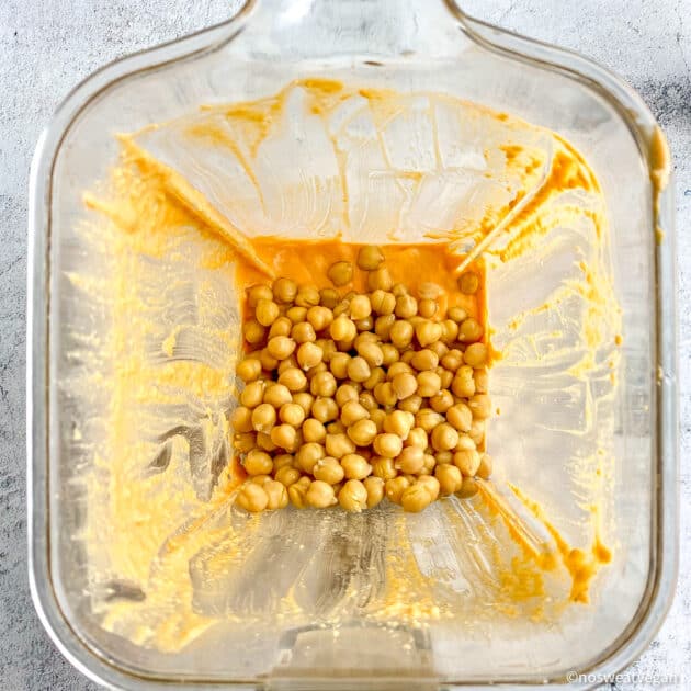 Buffalo chickpea dip in blended before pulsing chickpeas.