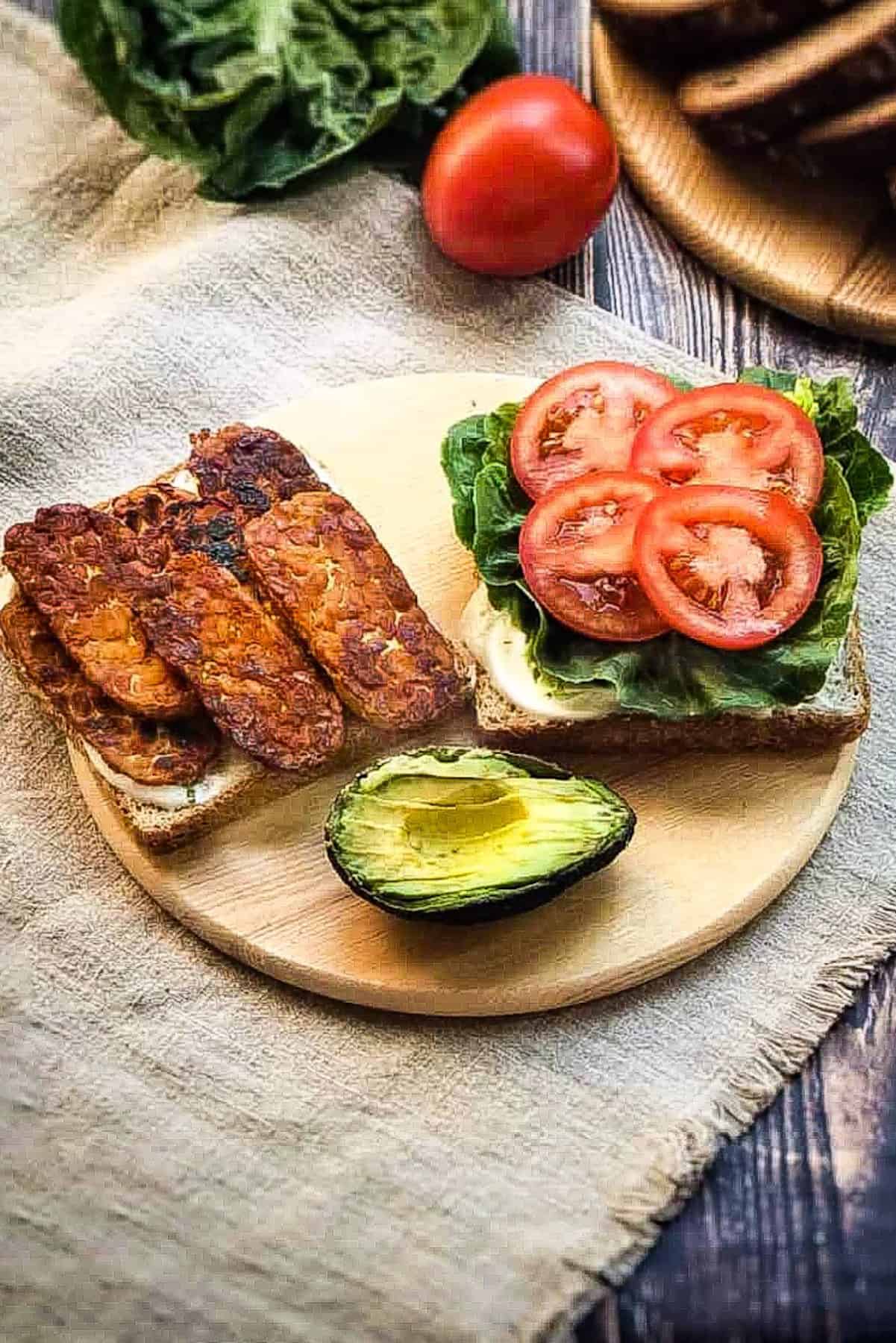 Vegan bacon on on sandwich.