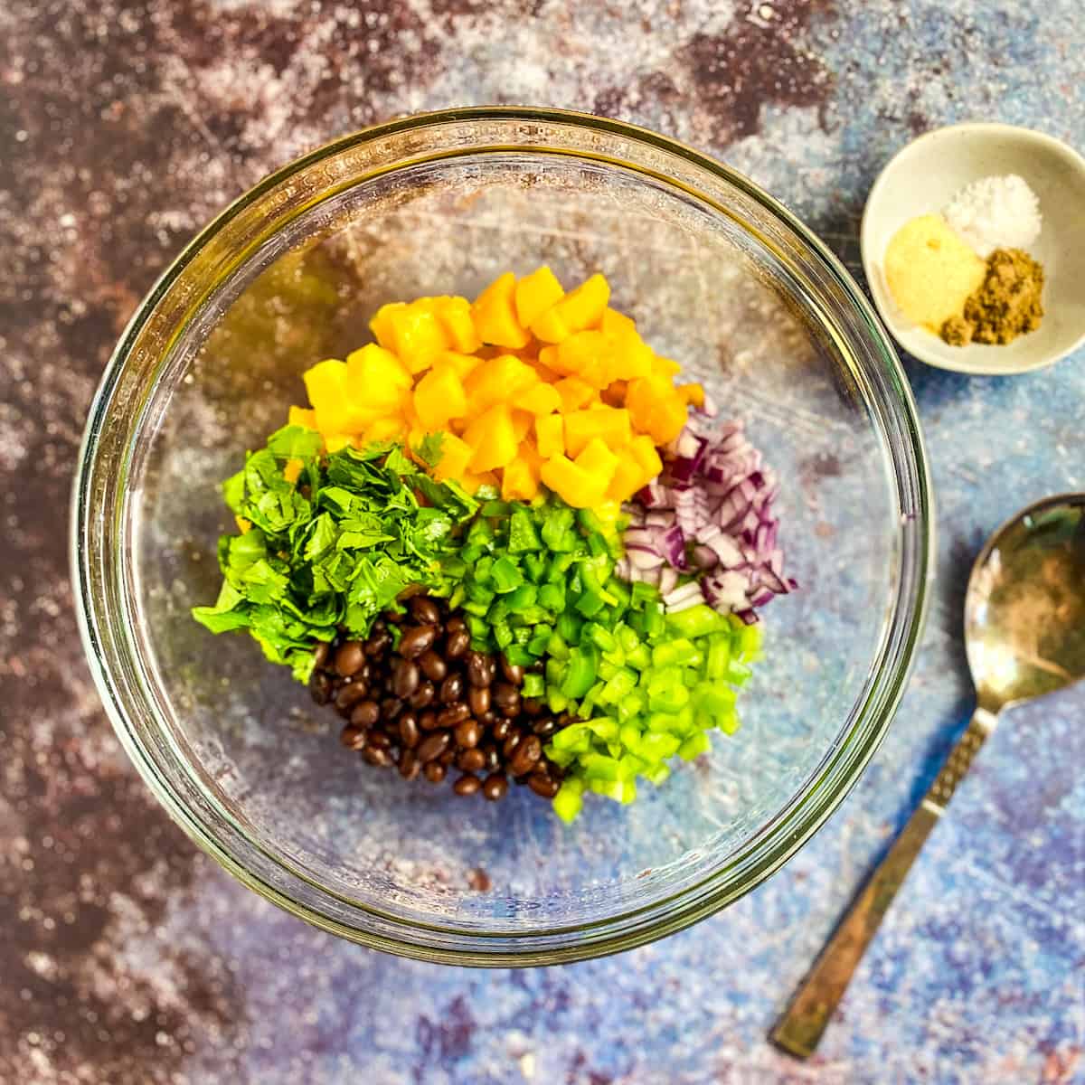 Mango black bean salsa ingredients in a bowl.