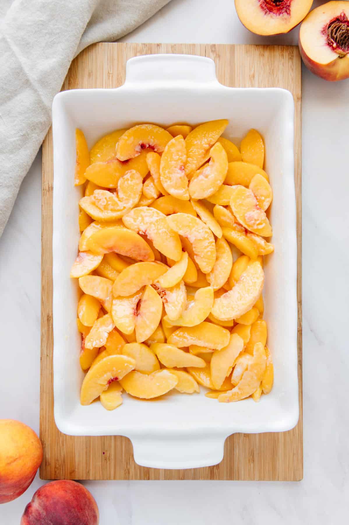 Frozen peaches in a dish.