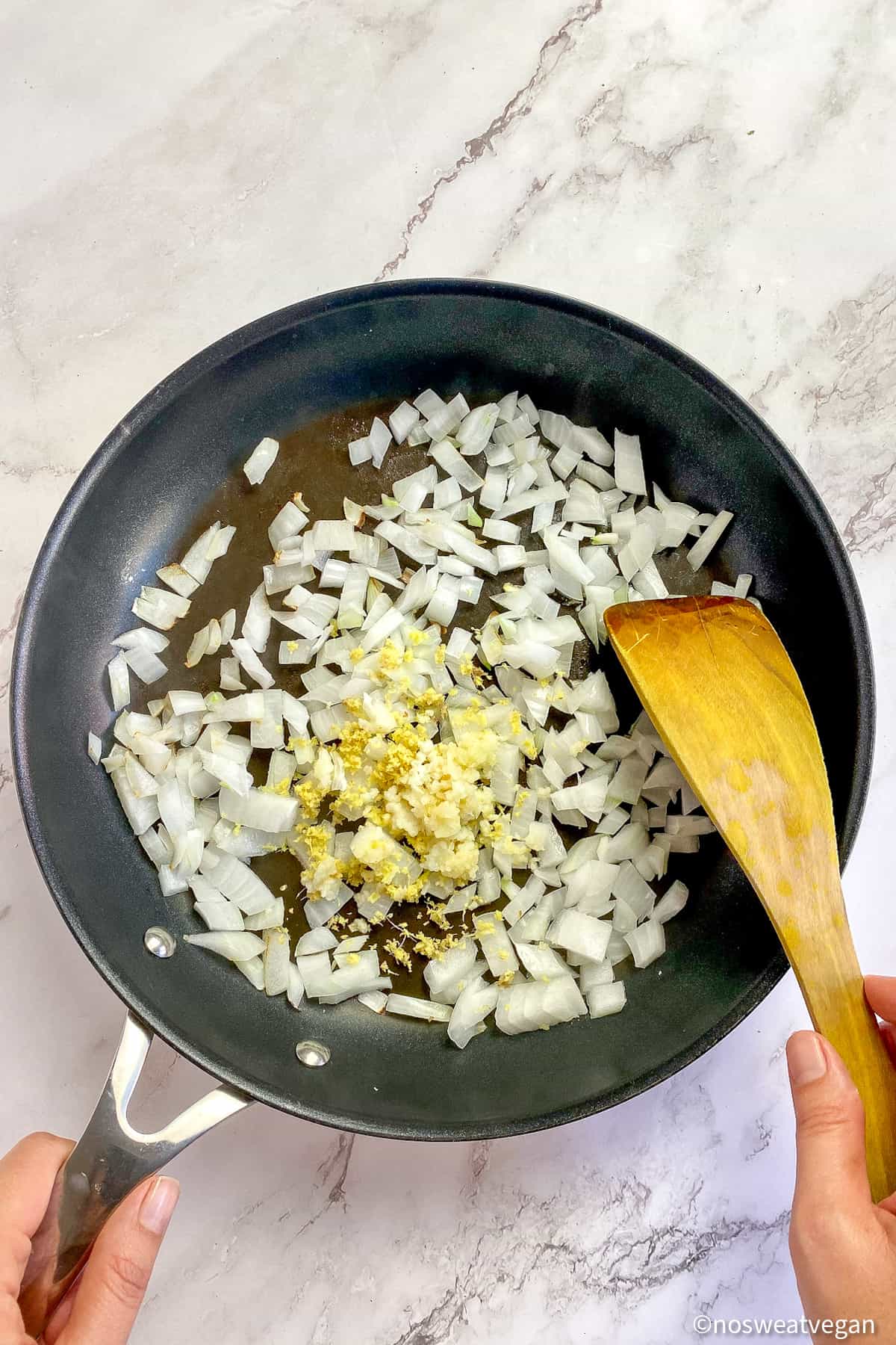 Diced onions, garlic, and ginger in a skillet.