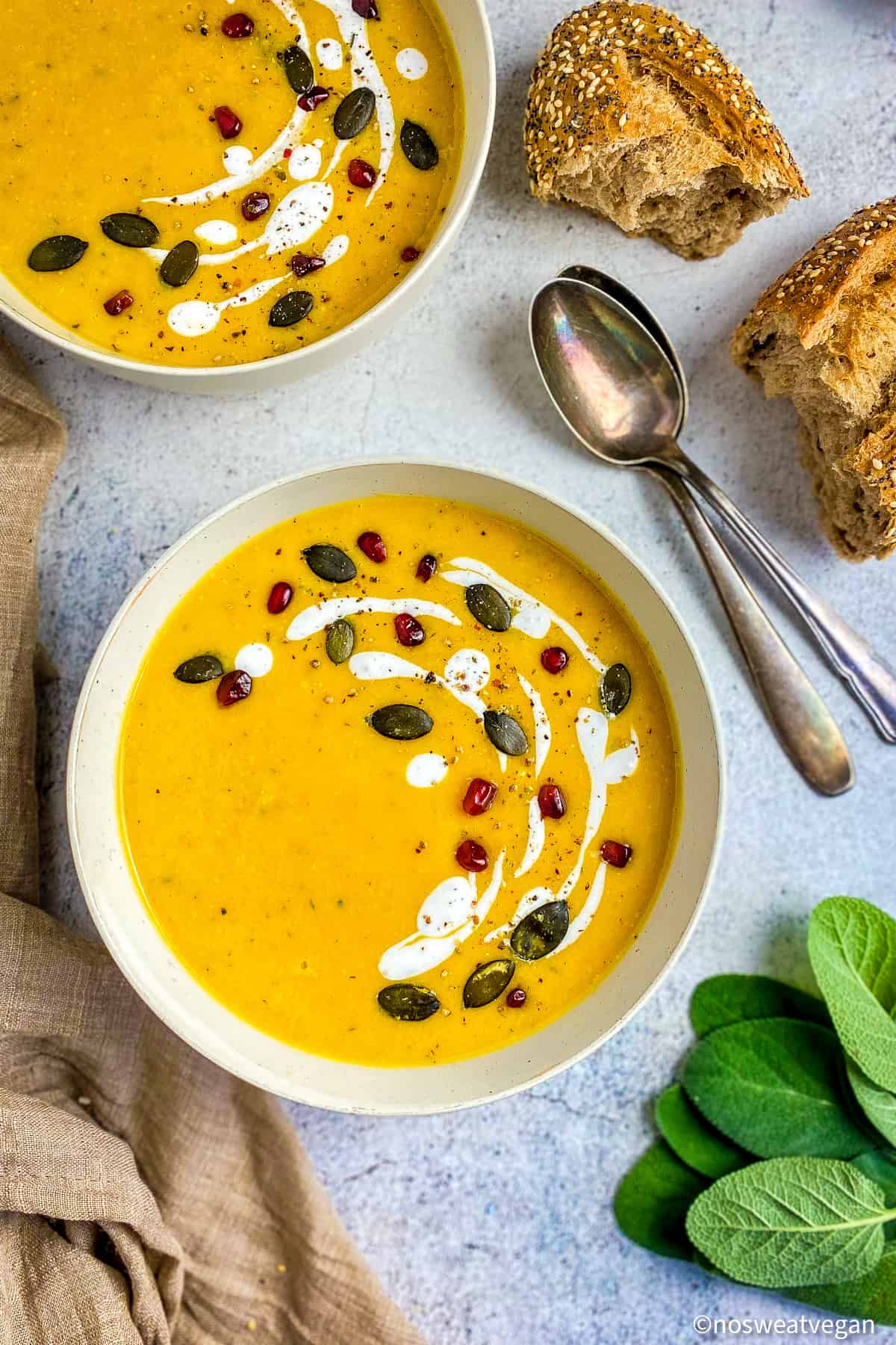 Roasted butternut squash soup in two bowls.