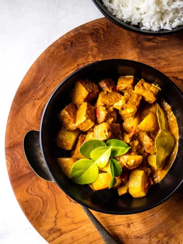 Balinese tempeh potato curry in a bowl.