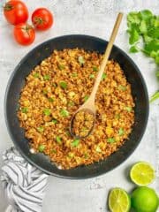 Sofritas in a skillet with a spoon.