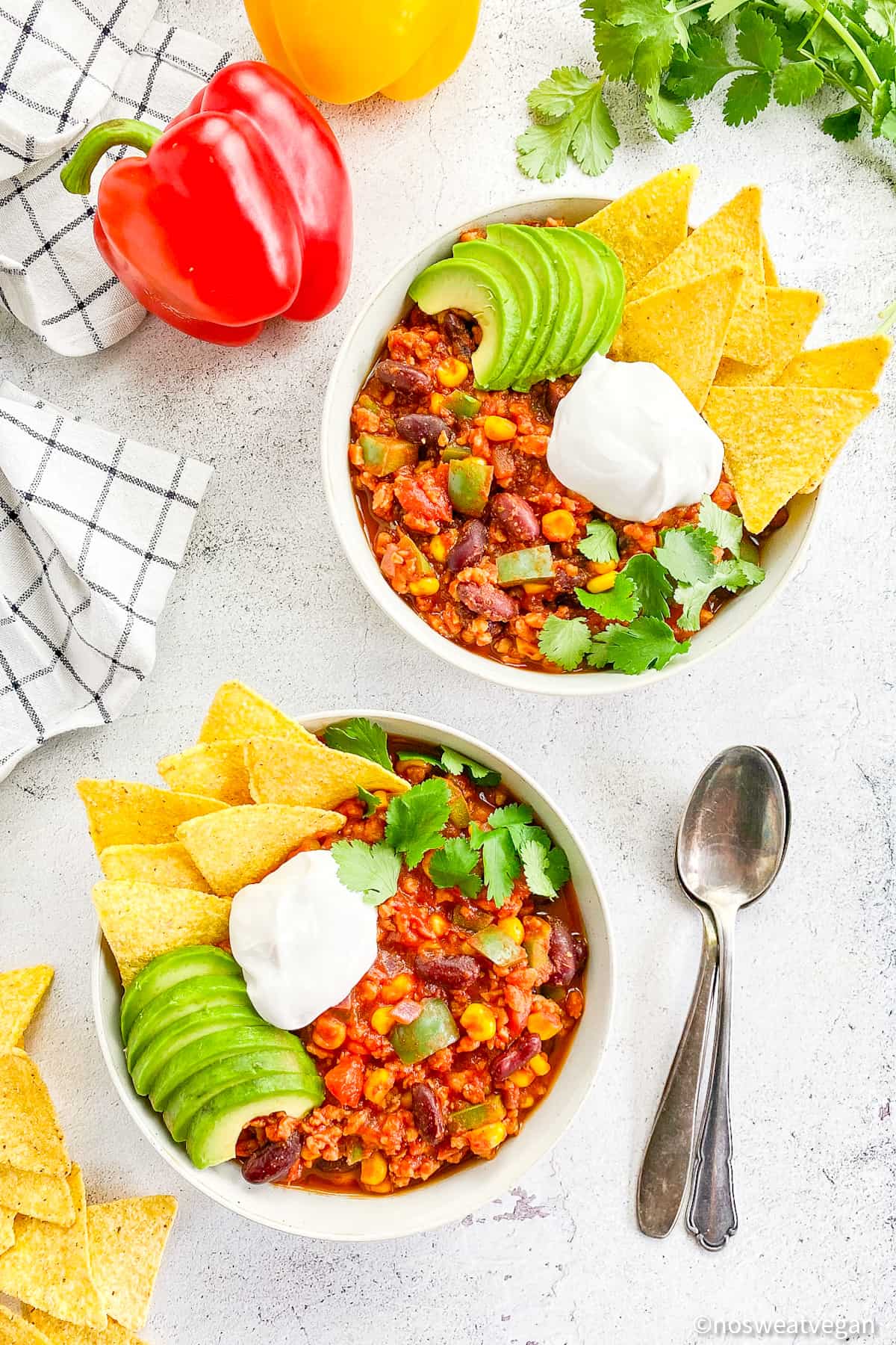 Two bowls with vegan chili.