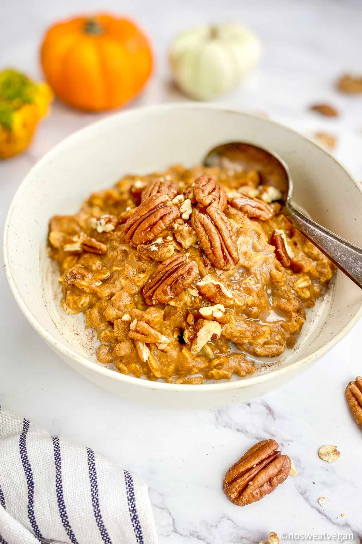 Bowl of pumpkin oatmeal with a spoon.